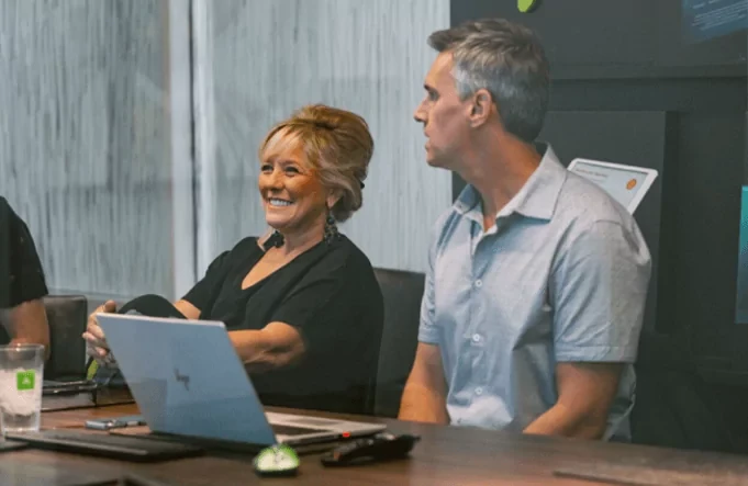 Founder and CEO Kristy Sexton sits beside Chief Marketing and Engagement Officer Michael Burnett in the conference room of Adcetera’s Midtown Houston office.