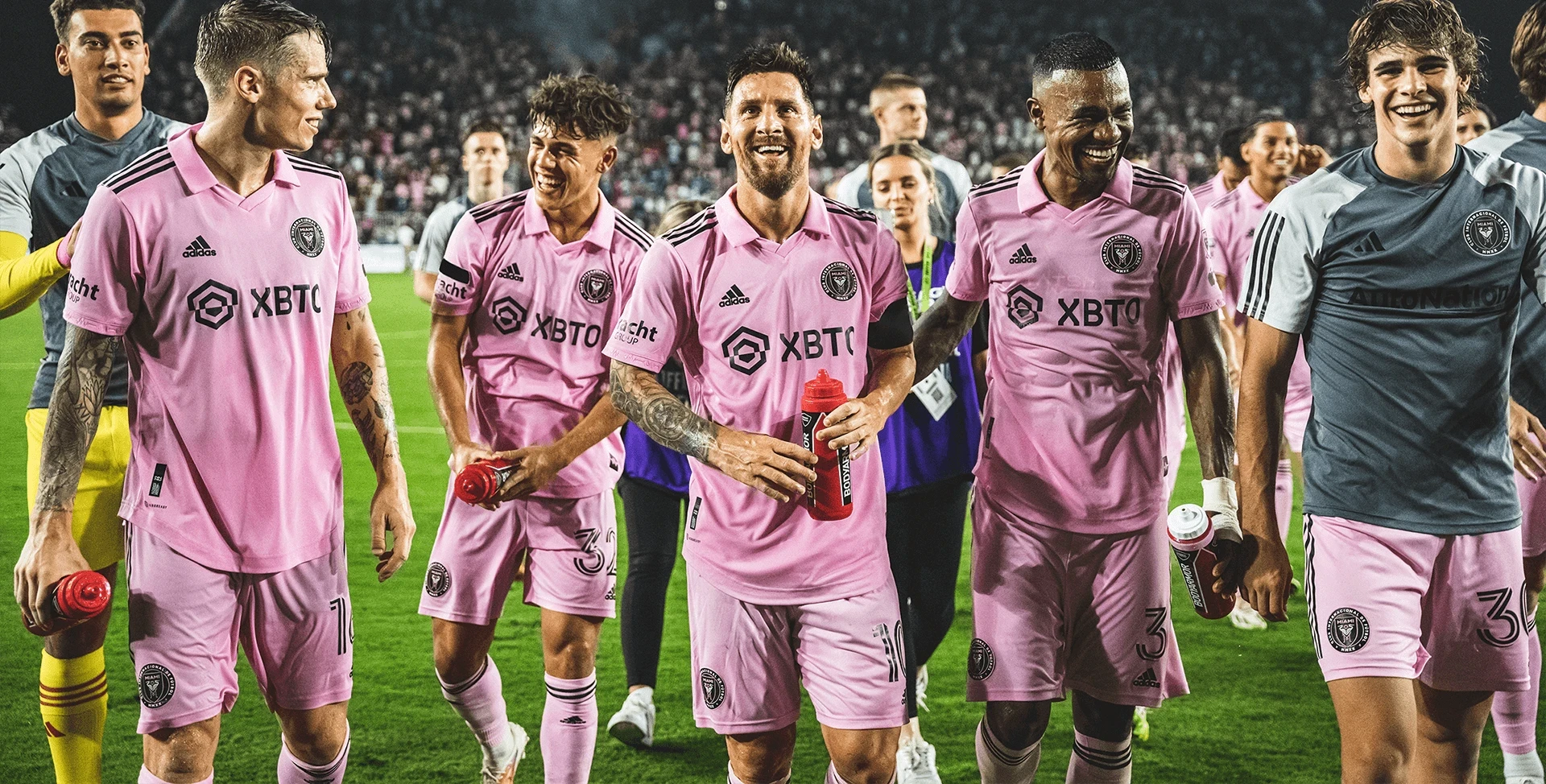 Inter Miami CF players on the pitch, including Lionel Messi front and center with the Fracht logo showing on the right arm of his kit.