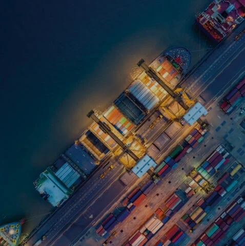 Overhead view of a container ship being unloaded.