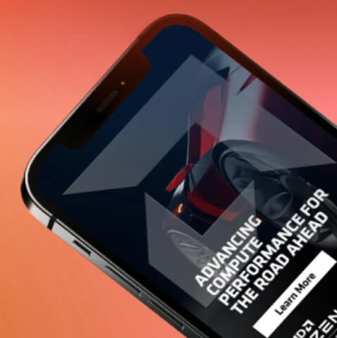 A close-up view of a smartphone with an AMD advertisement partially visible on screen.