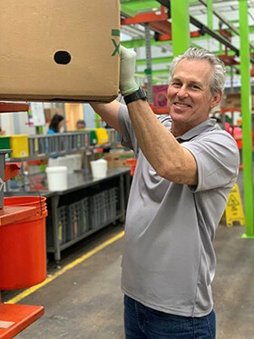Adcetera Chief Operations Officer John Sexton volunteers at the Food Bank.