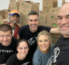 Adcetera employees volunteering at the Houston Food Bank.