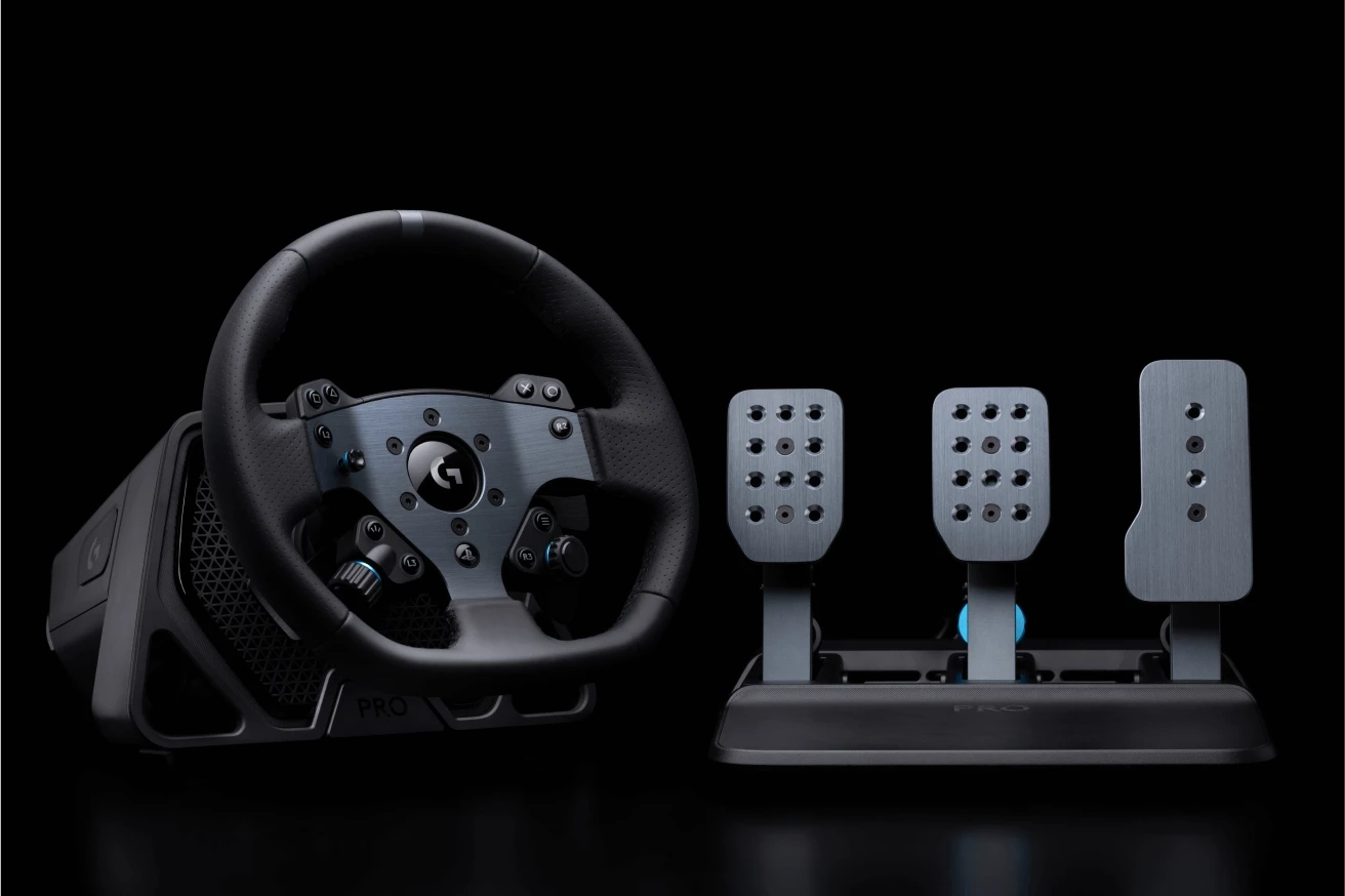 The Logitech G PRO Driving Wheel and Pedals, dramatically lit against a black background.