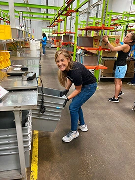 Adcetera Vice President (People and Performance) Dove Harrell volunteers at the Food Bank.
